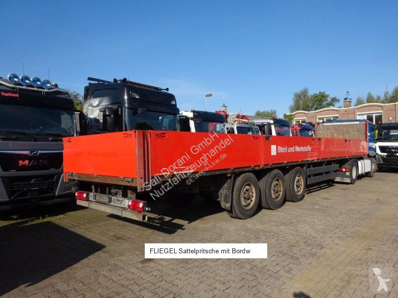 نصف مقطورة Fliegl Sattelpritsche mit Bordwänden...