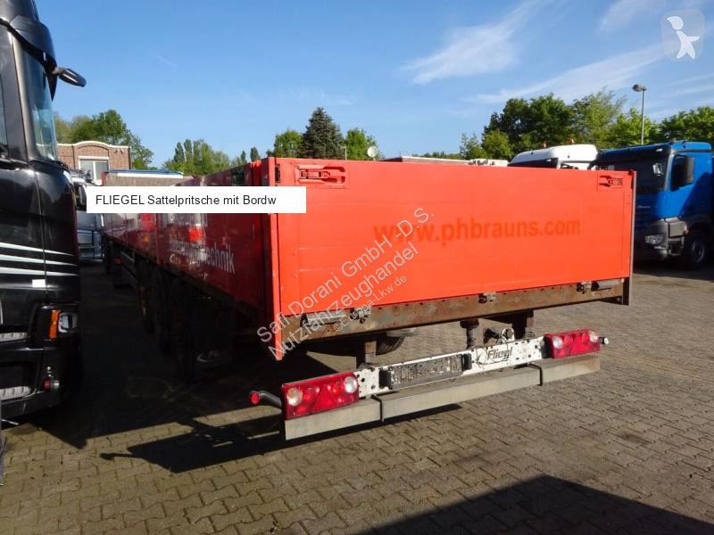 نصف مقطورة Fliegl Sattelpritsche mit Bordwänden...
