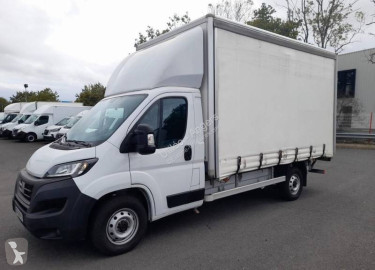 Fiat tarp covered bed flatbed van