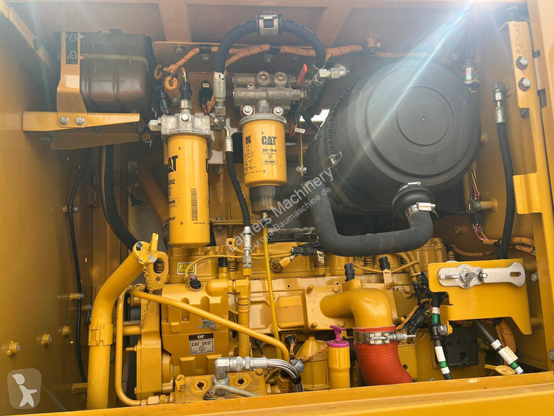 Grejder Caterpillar 140K .