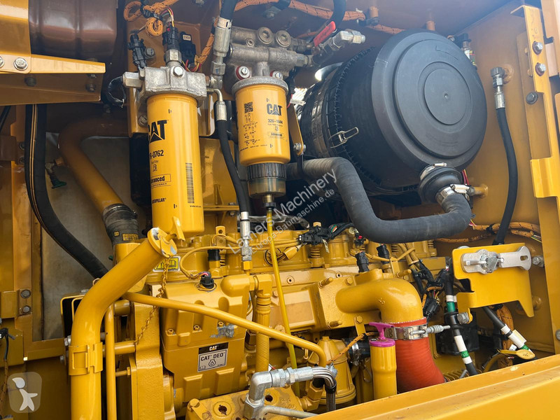 Grejder Caterpillar 140K .