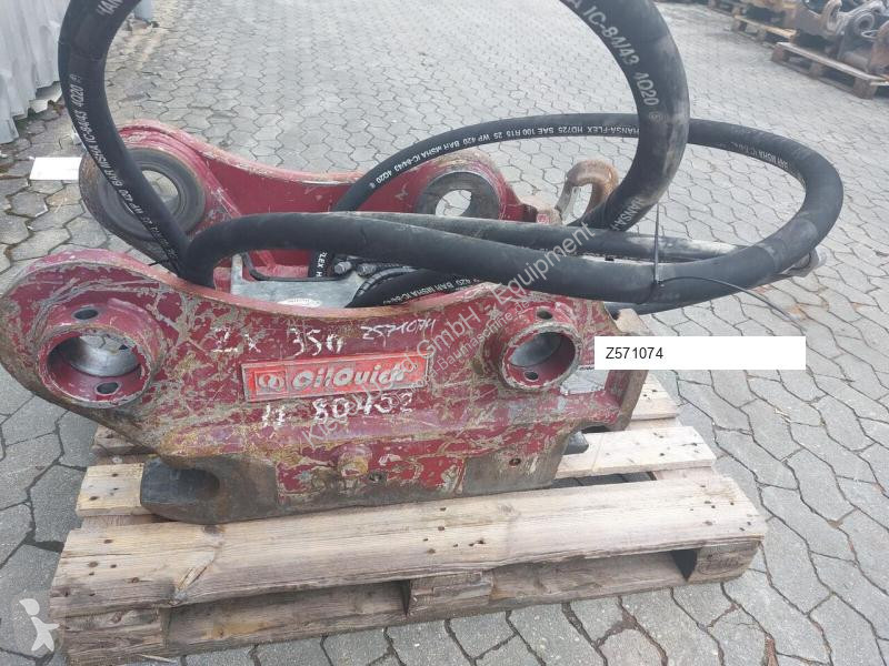 Stavební vybavení Oilquick Attache rapide...